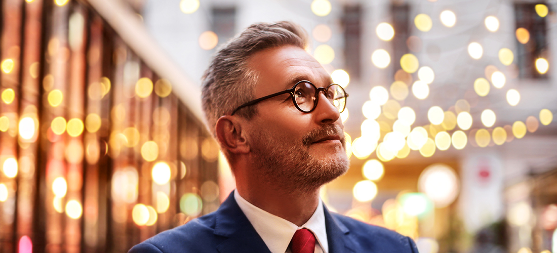 Man In Blue Suit With Glasses